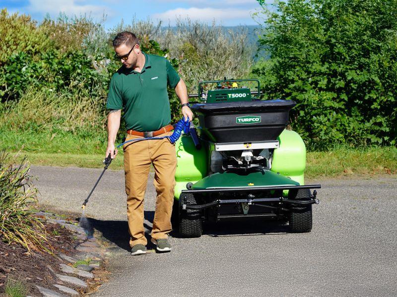 Onboard spray wand makes spot spraying landscaping simple