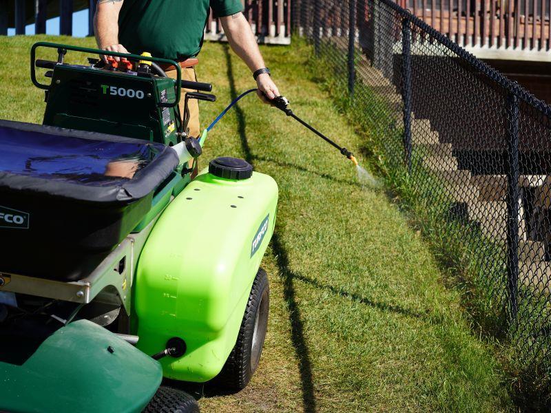 Onboard spray wand and hands free speed control handles fence lines fast